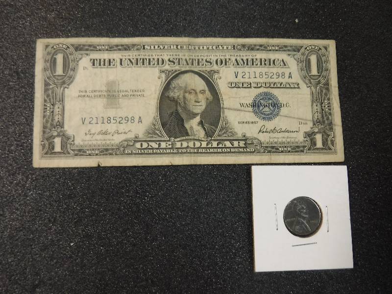 lot 9853 image: One Dollar Blue Seal Silver Certificate Series 1957 and a Steel Penny