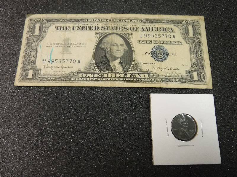 lot 9856 image: One Dollar Blue Seal Silver Certificate Series 1957B and a Steel Penny