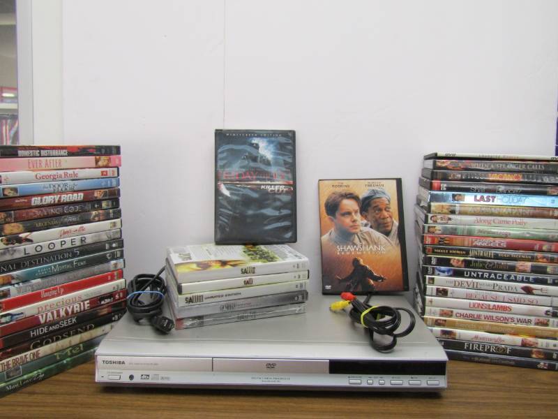 lot 3384 image: Toshiba DVD Player With Remote and DVD Lot - Movie Night
