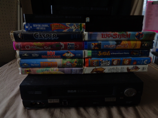 lot 9133 image: RCA VHS Player  16 Childrens VHS Movies