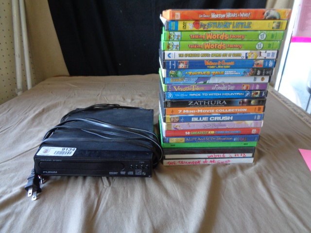 lot 9134 image: Funai DVD Player with 20 DVDS