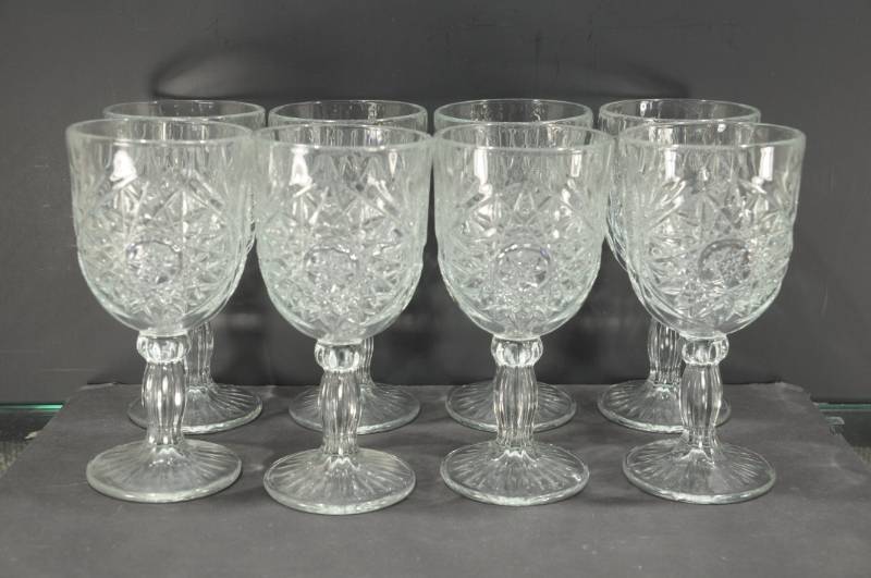 lot 2015 image: Set of 8 Press Cut Glass Star Pattern Water Goblets. 7 Tall