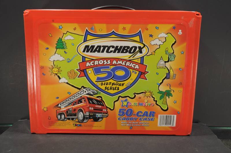 lot 2041 image: Matchbox Across America 50th Anniversary Series Vinyl Carry Case w. Fire Engines, Cement Mixers, Tow Trucks, Police Cars