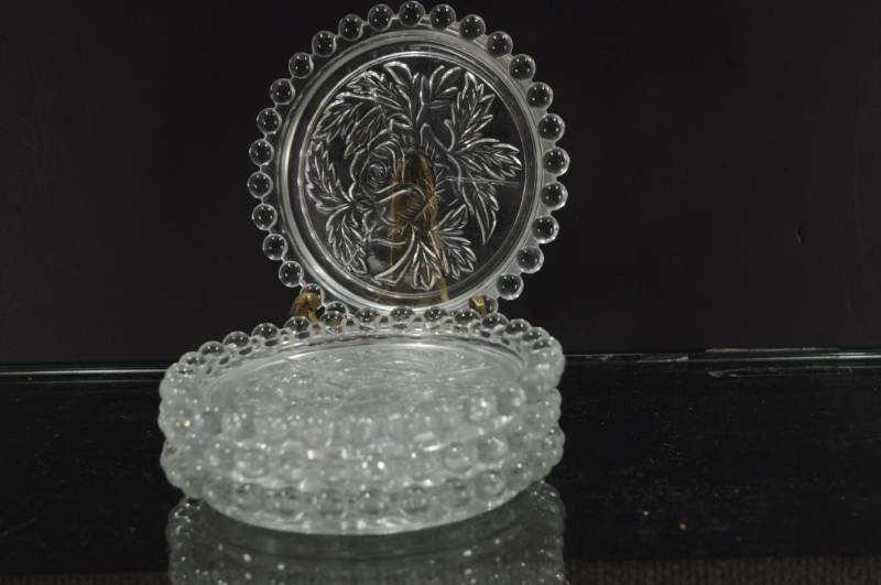 lot 2193 image: Set of 4 Press Glass Rose Pattern Coasters