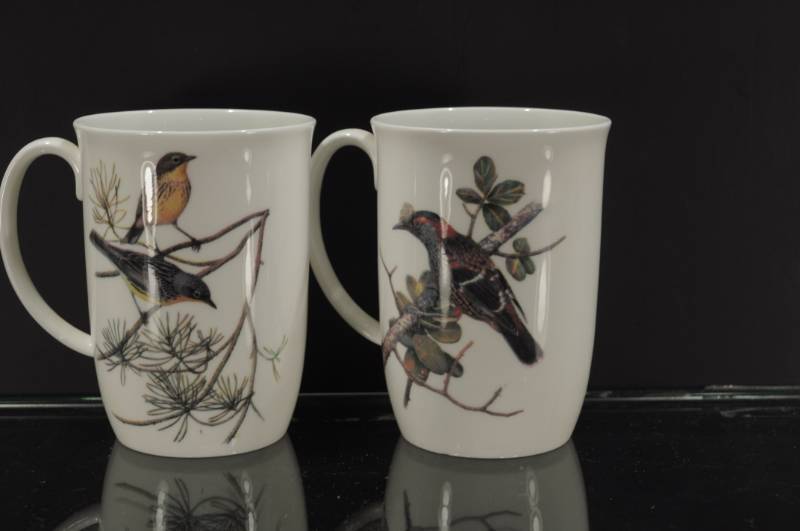 lot 2196 image: Pair World Wildlife Fund Bird Coffee Mugs. 4 38