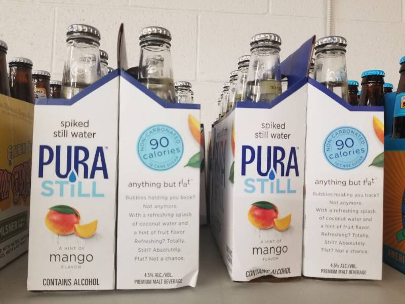 lot 15038 image: (4) Pura Still Spiked Water 6PK Mango Mandarin Orange