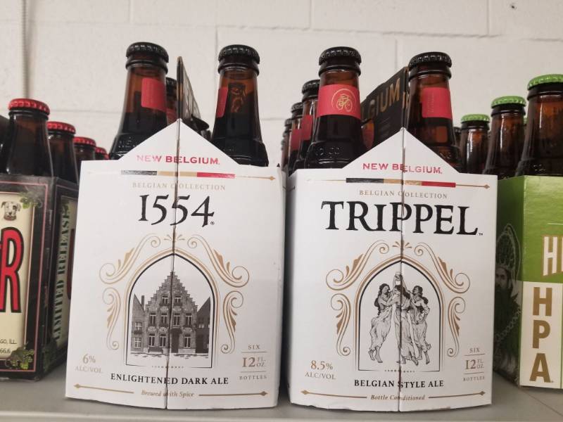 lot 15041 image: (3) New Belgian 1554 6PK, (1) New Belgium Trippel