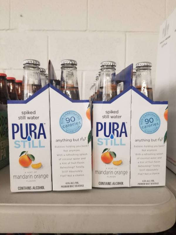 lot 15044 image: (4) Pura Still Spiked Water 6PK Mandarin OrangeMango