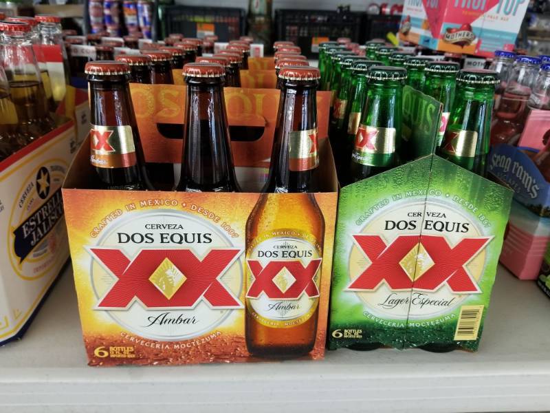 lot 15163 image: (2) Dos Equis Amber 6pks, (2) Dos Equis Lager 6Pks