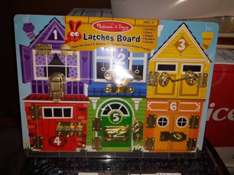 lot 14675 image: Melissa & Doug Latches Board Play Set