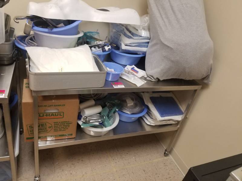 lot 5557 image: Stainless Table With Assorted Medical Supplies