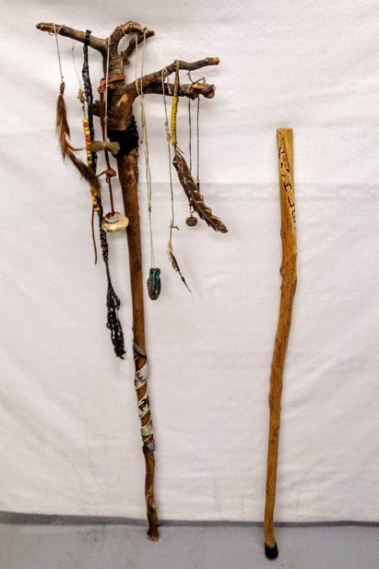 lot 5734 image: Walking Stick & Ornate Carved Stick w All Kinds of Things on it