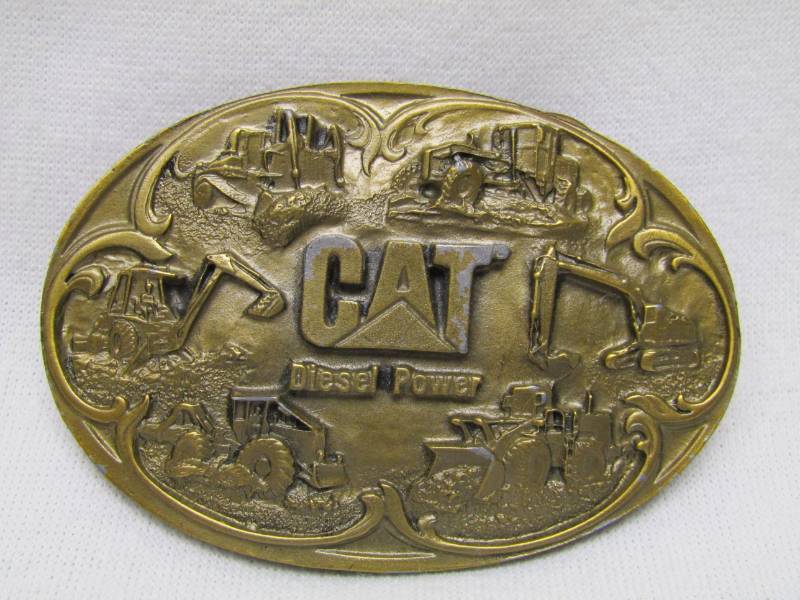 lot 5551 image: CAT Equipment Belt Buckle