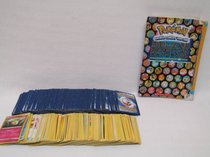 lot 5554 image: Pokemon Card Lot and Book- OVER 260 Un-Searched Cards