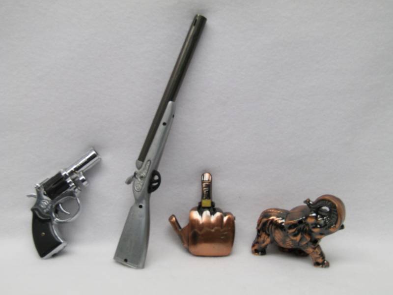 lot 5582 image: Torch Lighters-  2 Guns-1 Elephant- 1 Bird 4 Total