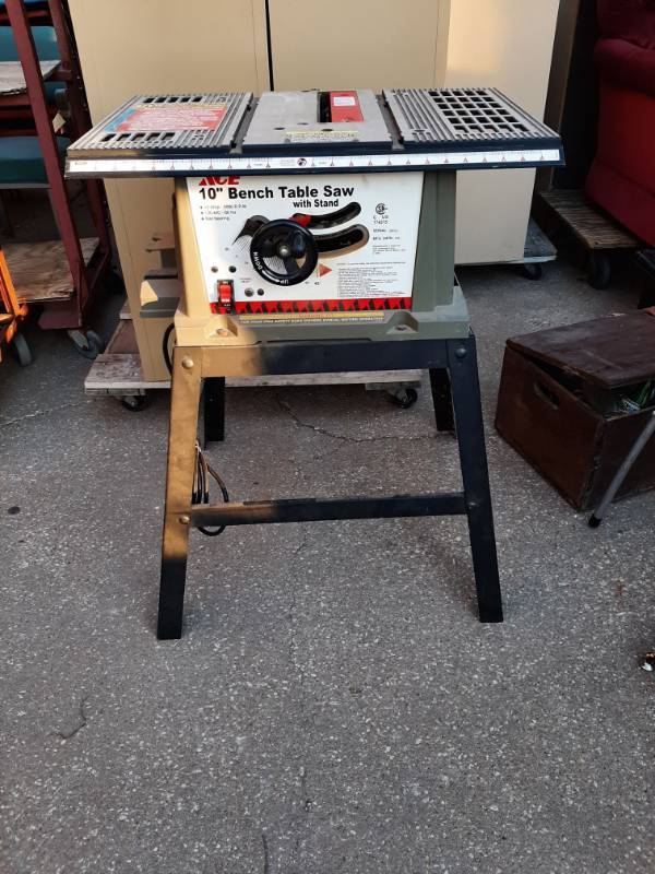 lot 1313 image: 10 bench table saw with stand - works