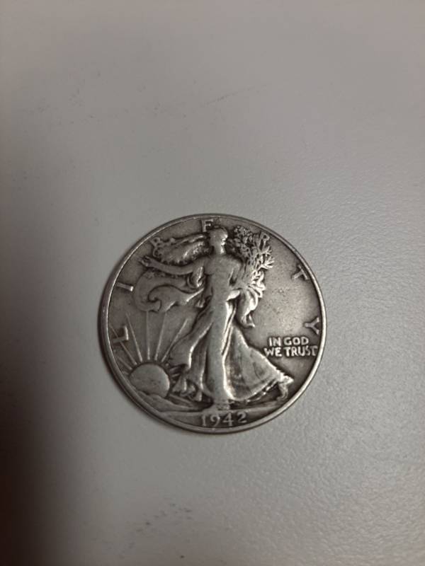 lot 1441 image: 1942 Walking Liberty silver half dollar