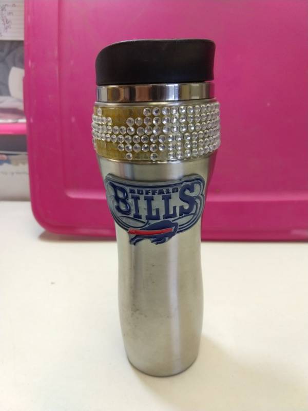 lot 2555 image: Buffalo Bills bling drinkware and fuzzy dice