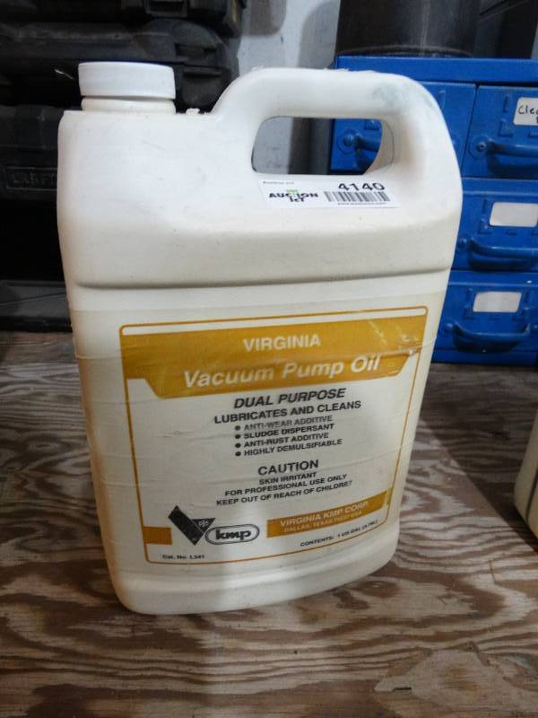 lot 4140 image: Partial jug of Virginia Vacuum pump oil