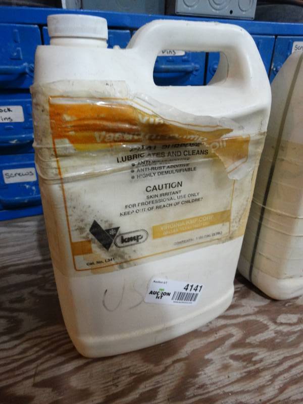 lot 4141 image: Partial jug of Virginia Vacuum pump oil