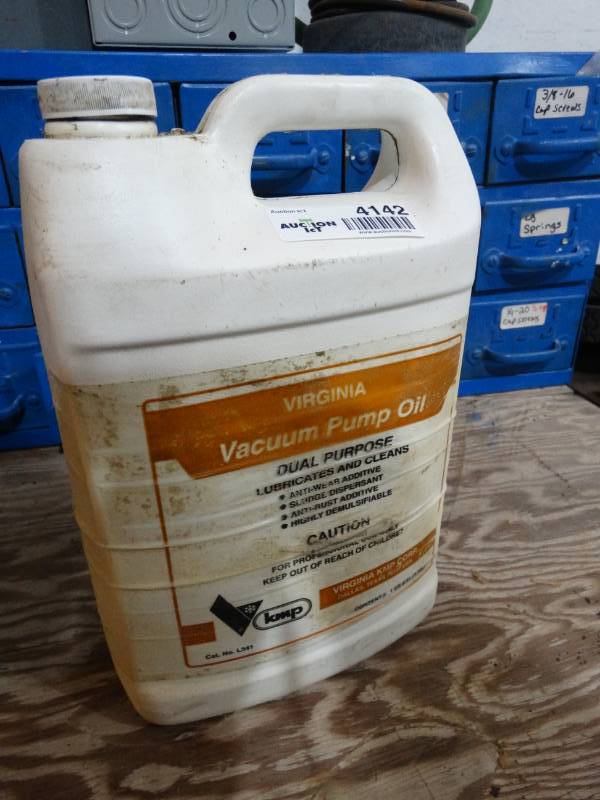lot 4142 image: Partial jug of Virginia Vacuum pump oil
