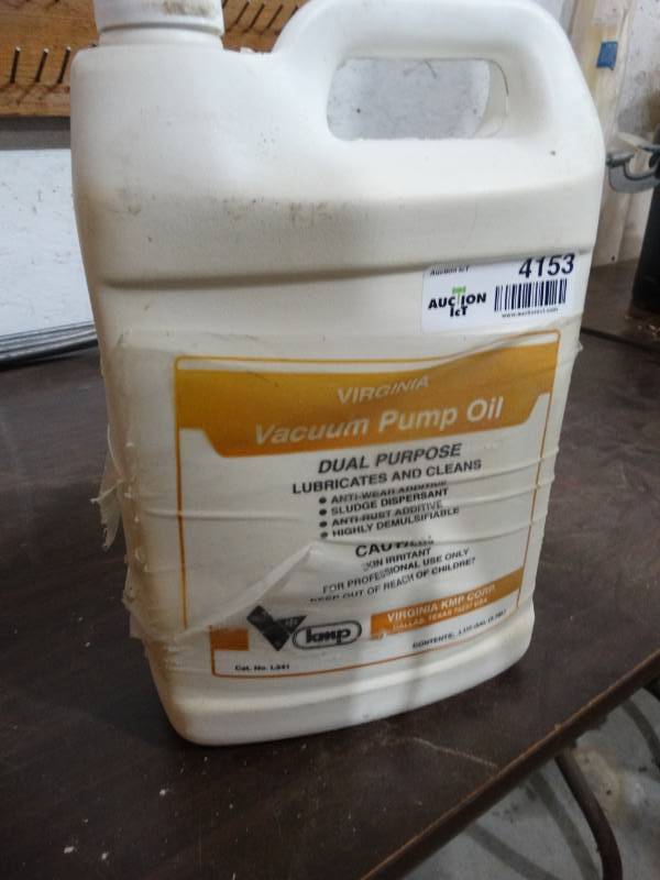 lot 4153 image: Partial jug of Virginia Vacuum pump oil