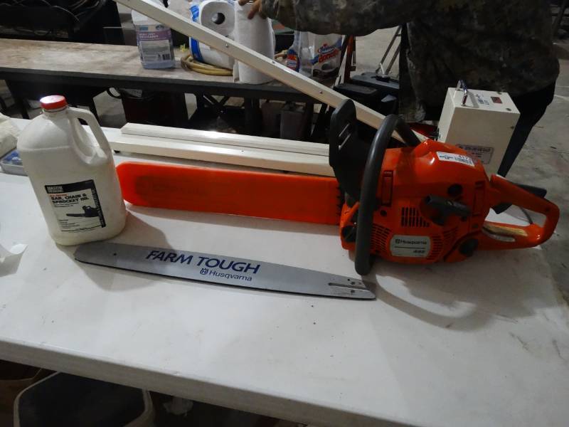lot 4173 image: Husqvarna 445 X-Torq gas chainsaw  w extra bar, jug of bar & chain oil, extra chain & blade cover-