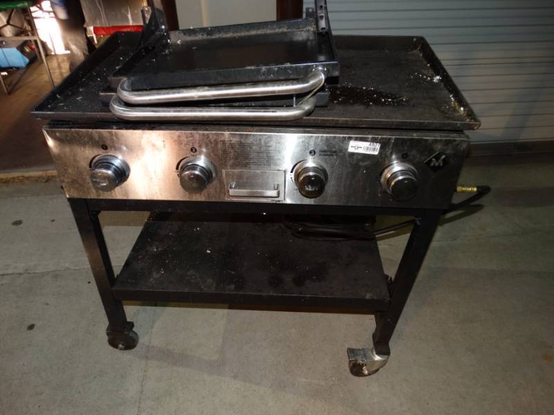 lot 4921 image: Propane flat grill on stand w wheels & 2 drop down side tables