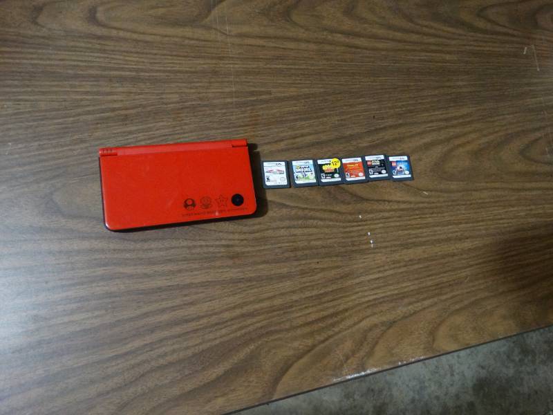 lot 2062 image: Nintendo DS With 6 Games