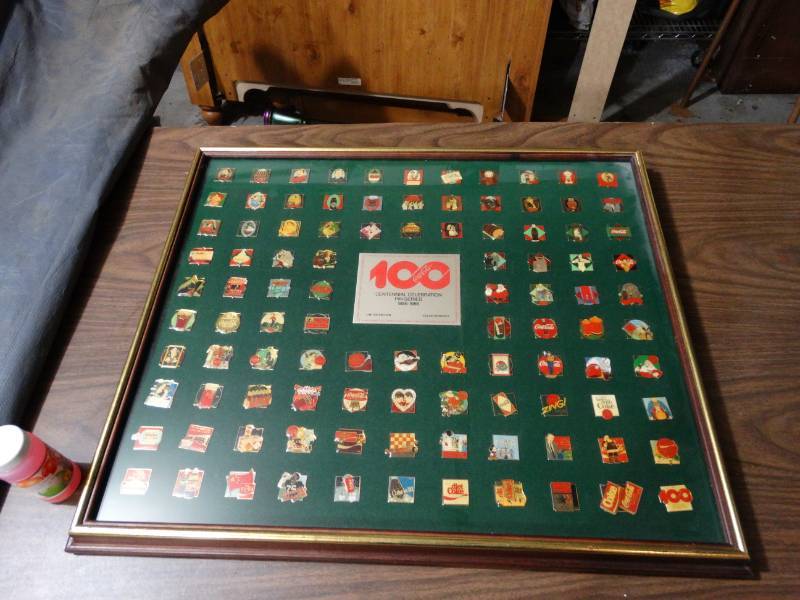 lot 2079 image: 100 Framed  Coca Cola Centennial Celebration Pin Series 1886-1986