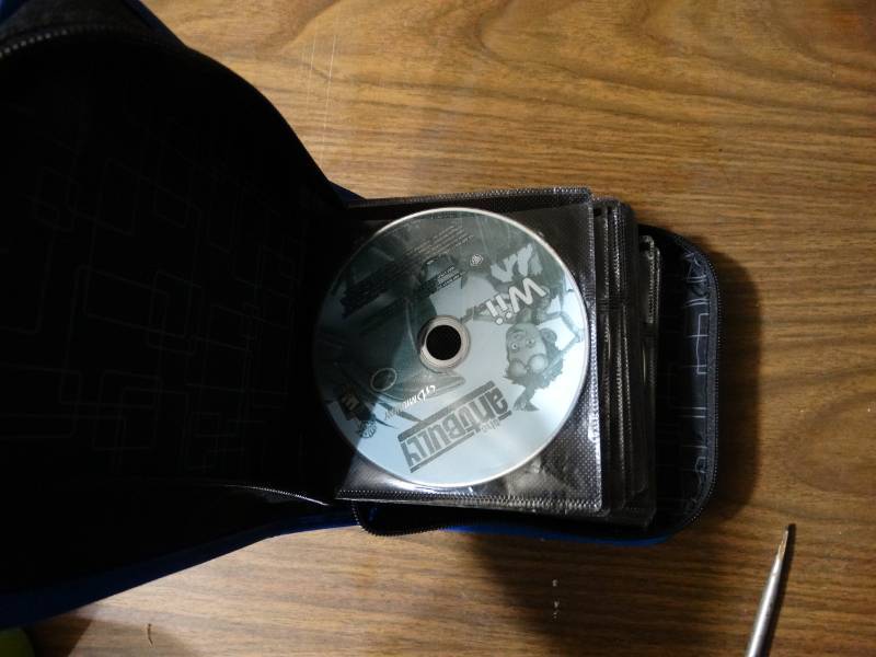 lot 2081 image: CD Organizer with Wii Games