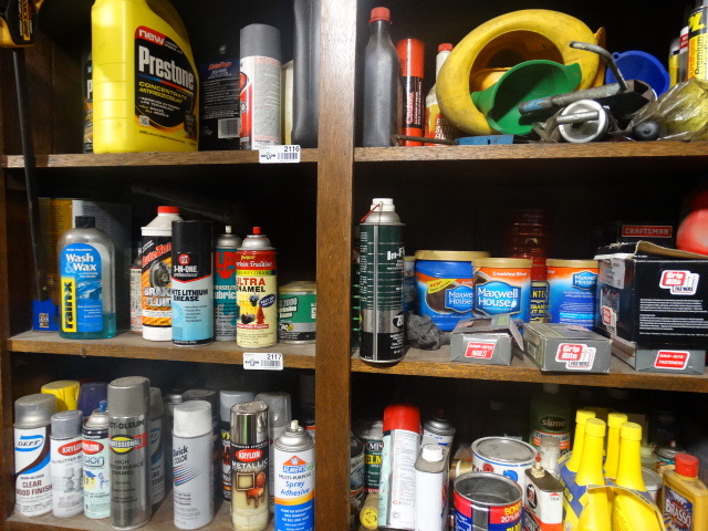 lot 2117 image: Shelf of finishing sprays, hardware and fluids
