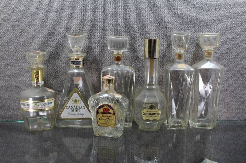 lot 2449 image: Lot of 7 Vintage Decanter Bottles. Old Charter, Walker, Crown Royal, and Canadian Mist