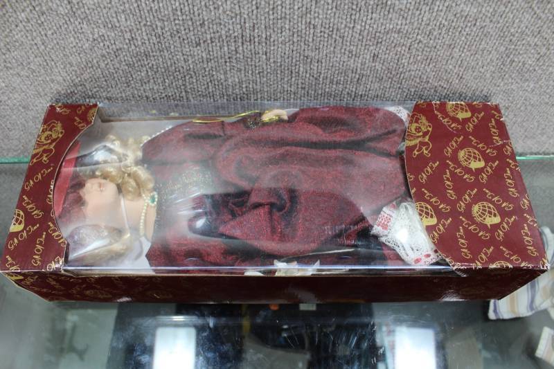 lot 2493 image: New In Box Gift of Time 18 China Doll With Burgandy Dress and Pearls