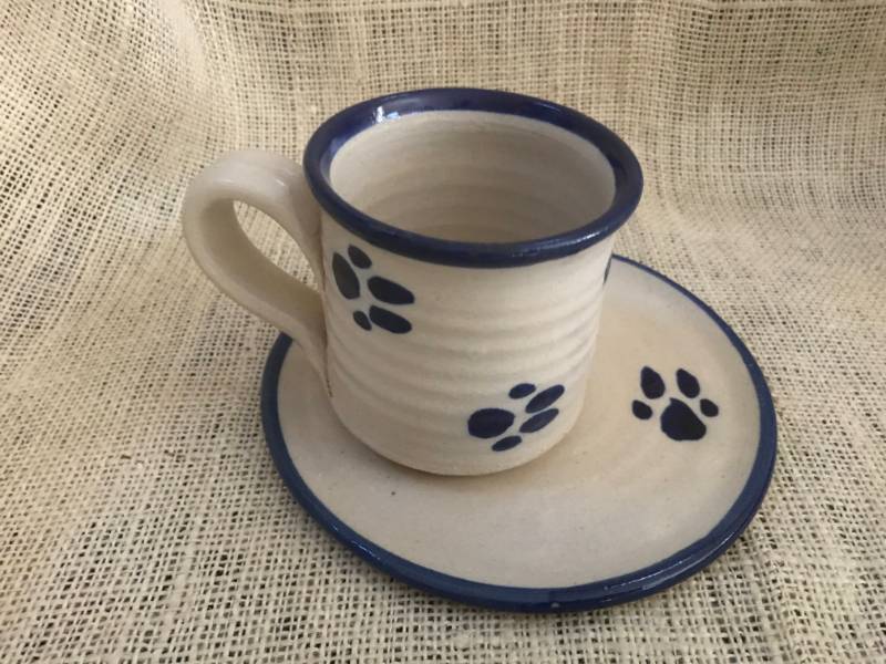 lot 1043 image: Crockery Coffee Cup & Saucer (with paw prints)