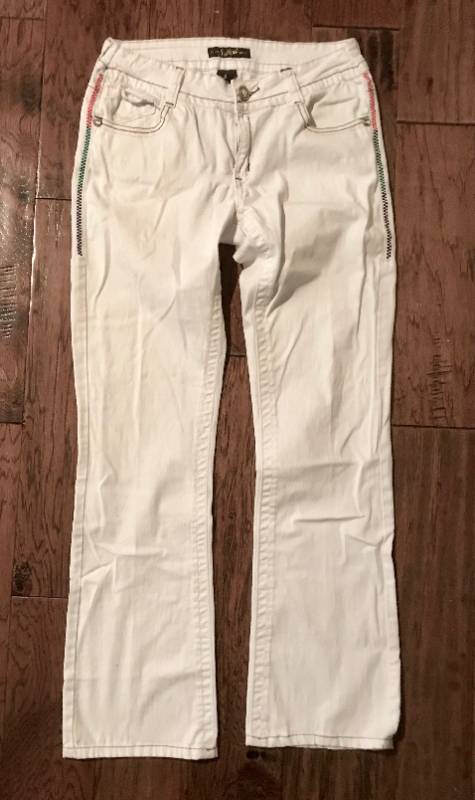 lot 1074 image: White denim jeans with colored stitching and button back pockets