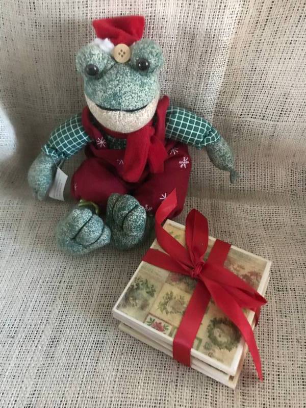 lot 1107 image: Merry Christmas Stuffed Frog and Christmas themed coasters