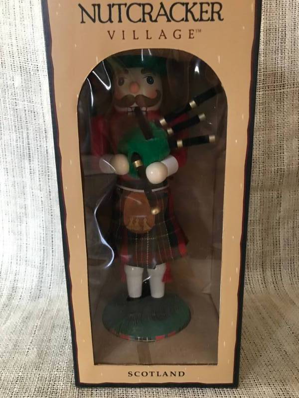 lot 1109 image: 12 Scotland Nutcracker in box--10th Anniversary Nutcracker Village Special Edition