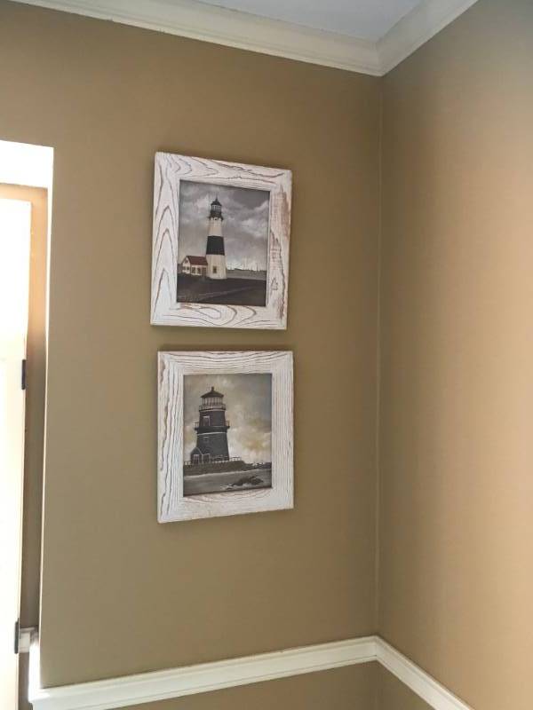 lot 1143 image: Set of two white washed framed lighthouses