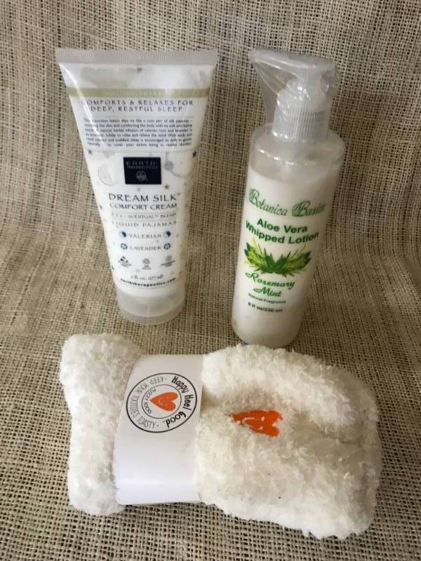 lot 1154 image: Lotions (new) and Happy Heel Good socks