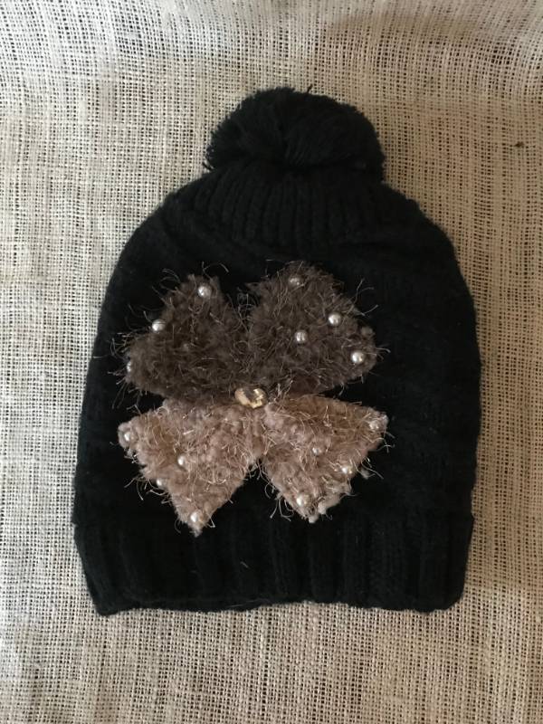 lot 1169 image: Fun Black Stocking Cap with bow and pearls