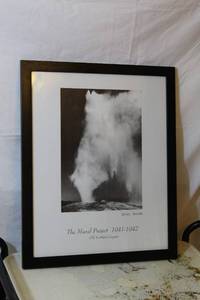 lot 1565 image: Ansel Adams Print - Old Faithful Geiser, framed in black plastic picture frame