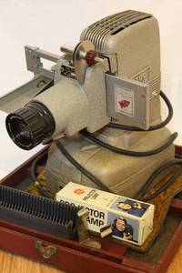 lot 1653 image: Vintage TDC Vivid Movie Projector in original case