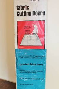 lot 1699 image: Fabric Cutting Board and Lot of Fabrics