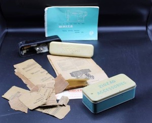 lot 1709 image: Lot of SingerWhite Sewing Machine PartsBooks and Accessories