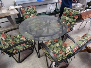 lot 7147 image: Outdoor patio set. table and 4 matching rocking chairs.