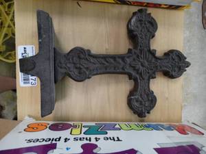 lot 7173 image: Metal cross decor and 2 books.