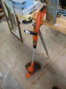 lot 7181 image: Black and Decker weed eater.