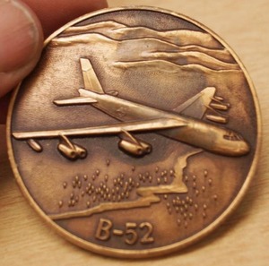 lot 4397 image: Vintage B-52 Airplane Coin - Neat Find
