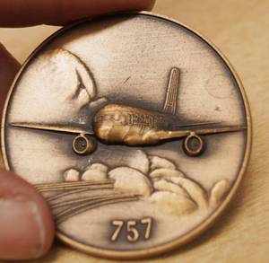 lot 4399 image: Vintage 757 Airplane Coin